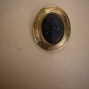Gold and Black Cameo Brooch